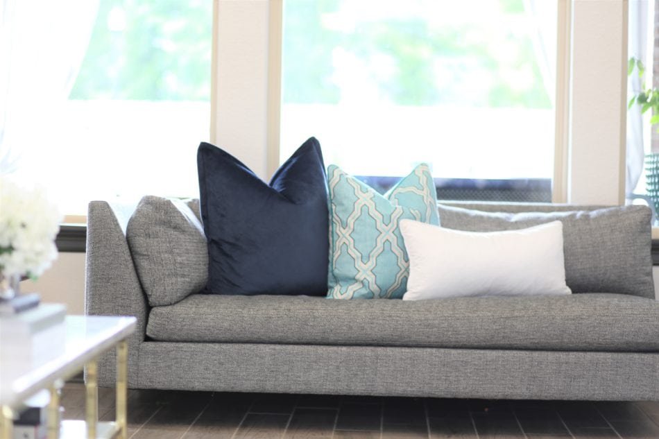 living room decor, living room colors, blue living room, gray sofa, bar stools at island. ivory kitchen, summer decor, blue summer decor, summer living room, colorful living room, coffee table, marble coffee table, coffee table decor, hydrangeas, blue vases, built ins, living room built ins, display box, living room pillows, blue pillows, navy pillows