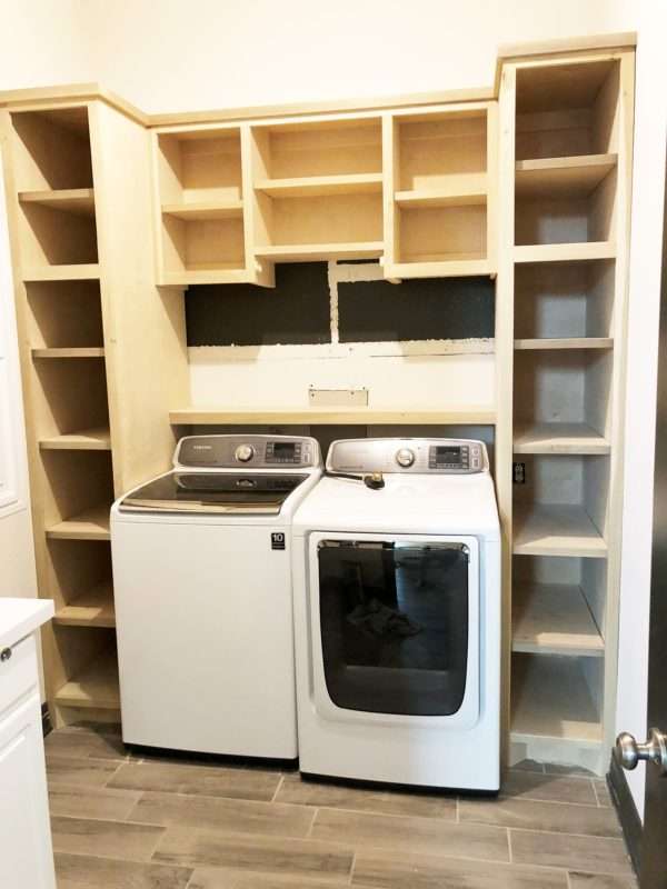cabinets for a top load washer