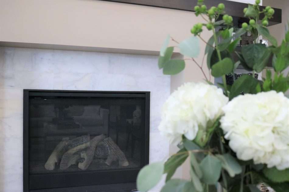 MRI, Melissa Roberts Interiors, Houston Interior Designer, Houston Interior Design, Beaumont Interior Design, Living Room Update, Living Room Reveal, Living Room Refresh, How to refresh your living room, summer living room, kitchen barstools, kitchen counter stools, kitchen pendant lights, living in your home during construction, fireplace remodel, modern fireplace, white sofa, wall mirror, gold wall mirror, chase lounge, unique chairs, living room accessories, how to style your living room, how to stage your living room, 2019 Living Rooms, minimalist design 