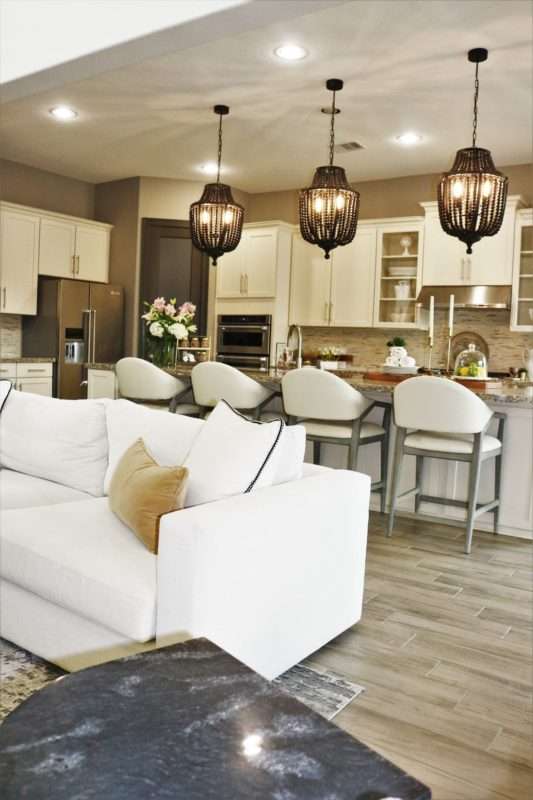 MRI, Melissa Roberts Interiors, Houston Interior Designer, Houston Interior Design, Beaumont Interior Design, Living Room Update, Living Room Reveal, Living Room Refresh, How to refresh your living room, summer living room, kitchen barstools, kitchen counter stools, kitchen pendant lights, living in your home during construction, fireplace remodel, modern fireplace, white sofa, wall mirror, gold wall mirror, chase lounge, unique chairs, living room accessories, how to style your living room, how to stage your living room, 2019 Living Rooms, minimalist design 